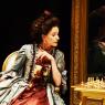 Belinda Lang as Lady Sneerwell, controlling those around her like chess pieces on a board
