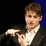 Will Adamsdale as Chris John Jackson, a manic, self-promoting American life coach