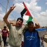 Fighting for the flag: director Emad Burnat's two best friends, the confrontational Adeeb (left), and the ever-optimistic Phil