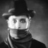Ivor Novello as the mysterious title character, dressed for the London fog, in 'The Lodger'