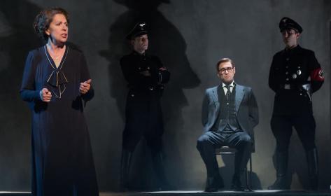 Irmgard (Penelope Wilton) explains the predicament of her son Hans (Martin Hutson)