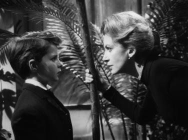 Miss Giddens (Deborah Kerr) takes the measure of young Miles (Martin Stephens) in 'The Innocents'