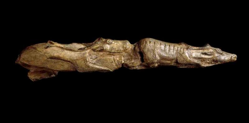 Tip of a mammoth tusk carved as two reindeer depicted one behind the other (13,000 years old approximately). Montastruc, France