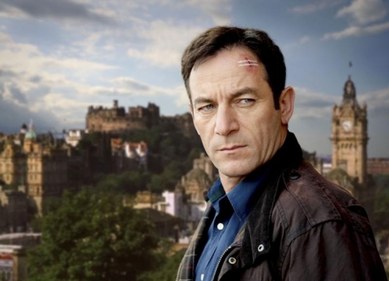 Jason Isaacs as Jackson Brodie scowls against the brooding Edinburgh skyline in 'Case Histories'