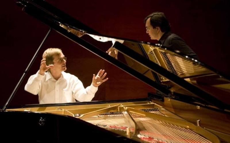 Stefan Knüpfer (left) discusses the arcane mysteries of piano preparation with Pierre-Laurent Aimard