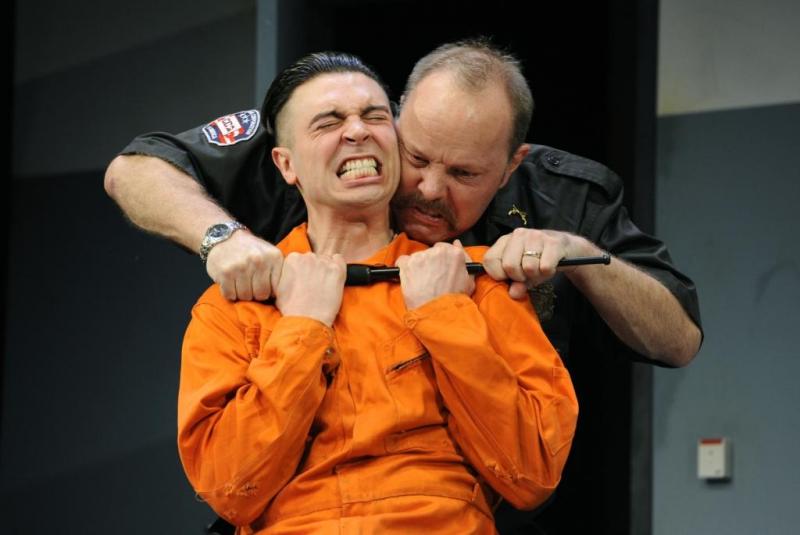 Jail bird: Ryan Gage as prisoner Lee Fenton feels the attentions of David Schaal's warden