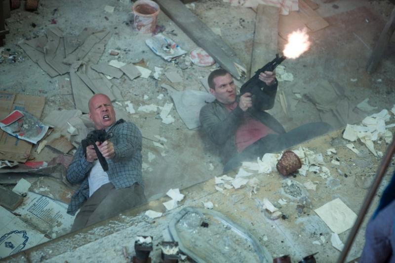 A good day to watch paint dry: Bruce Willis and Jai Courtney have some family time