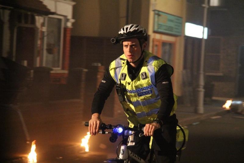 PC Baz Vartis (Kevin Bishop) keeps deadly order on his beat, on his bicycle