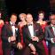 The Rat Pack and friends toast Christmas. Left to right: Dean Martin (Mark Adams), Frank Sinatra (Stephen Triffitt), Sammy Davis Jr (Giles Terera)