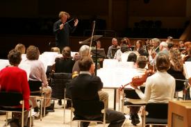 Deneve rehearsing the Royal Scottish National Orchestra
