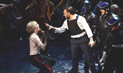 Andrew Polec as Strat confronts Rob Fowler's Falco