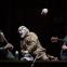 Jacques Imbrailo's Laertes and Allan Clayton's Hamlet listen to the skull-tossing Gravedigger (John Tomlinson)