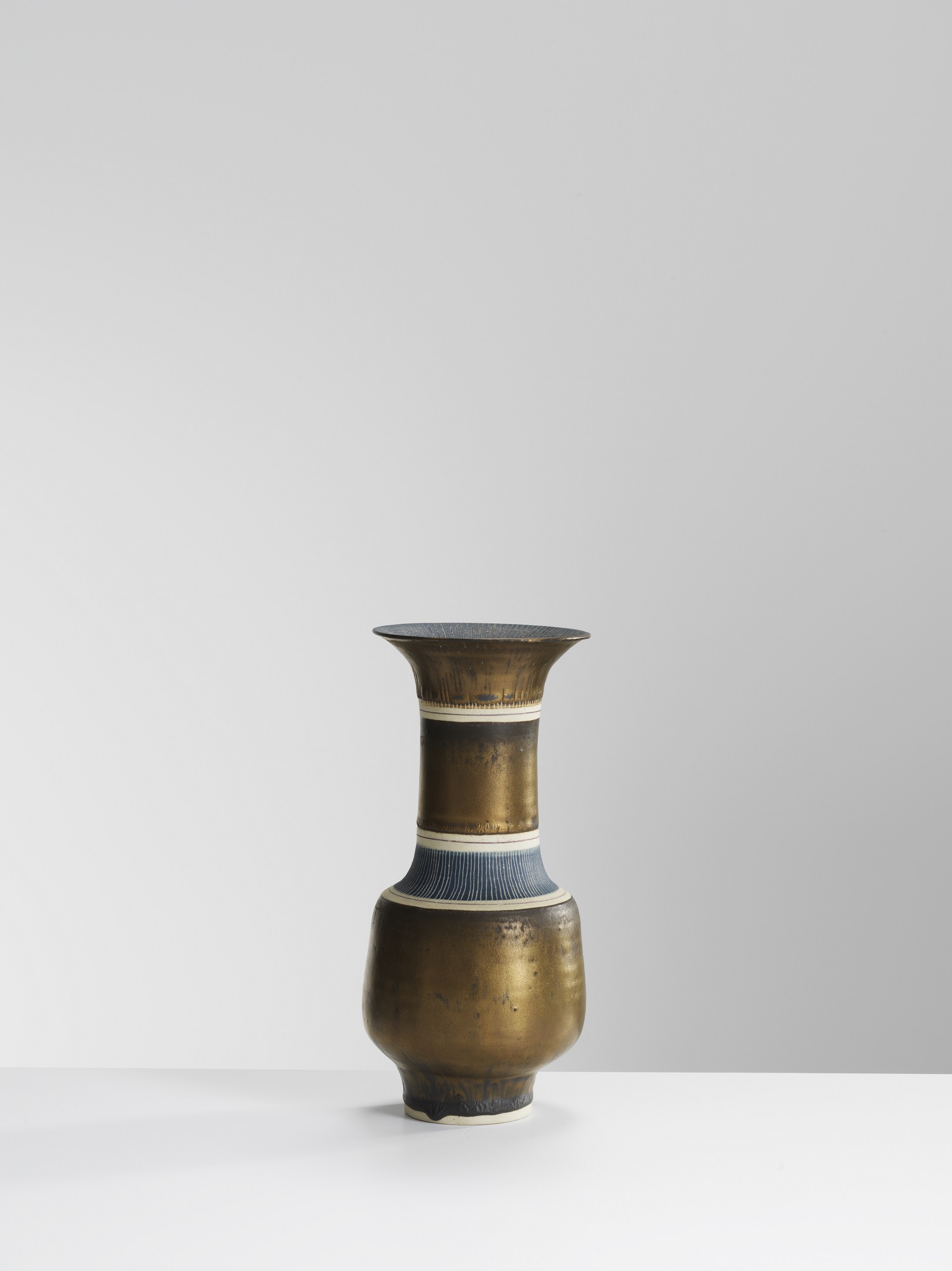 Lucie Rie, Bronze Vase with sgra ffi to, porcelain with manganese glaze (23 x 10.5 cms) Image: Michael Harvey