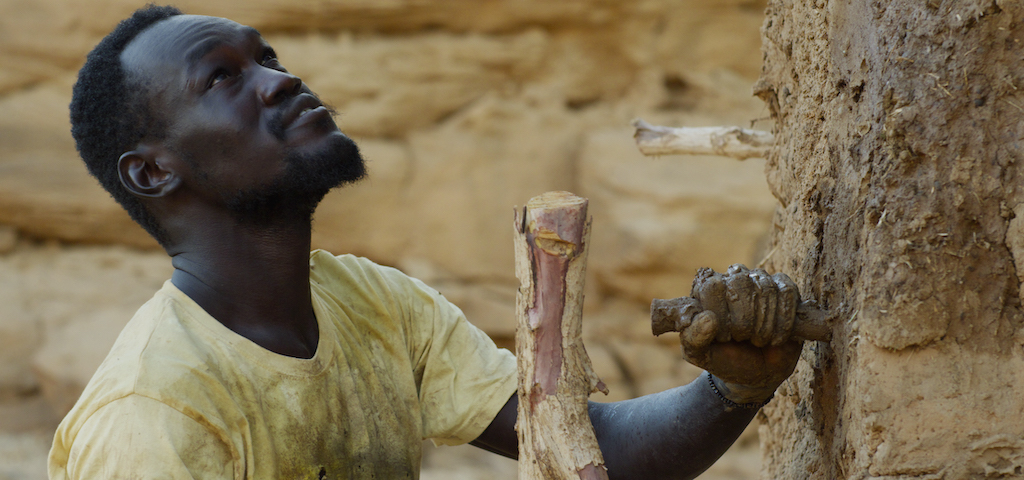 Maher builds his Golem. Still from The Dam by Ali Cherri