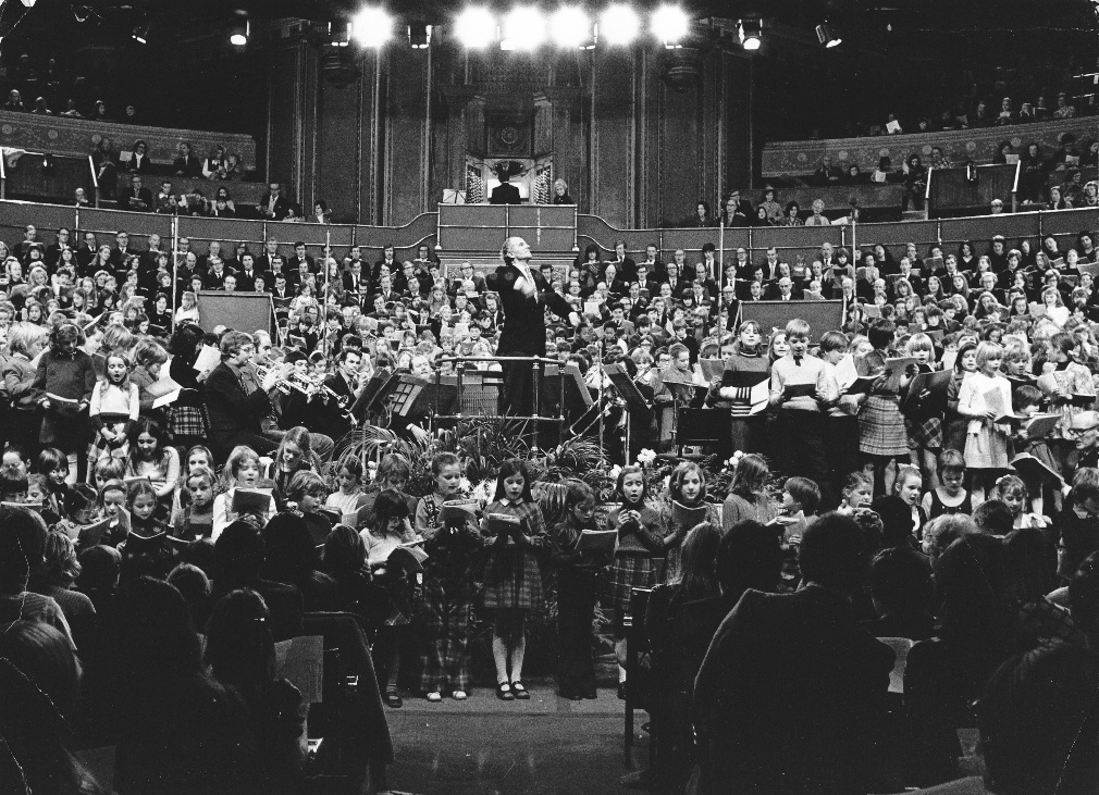 Sir David Willcocks conducting carol concert