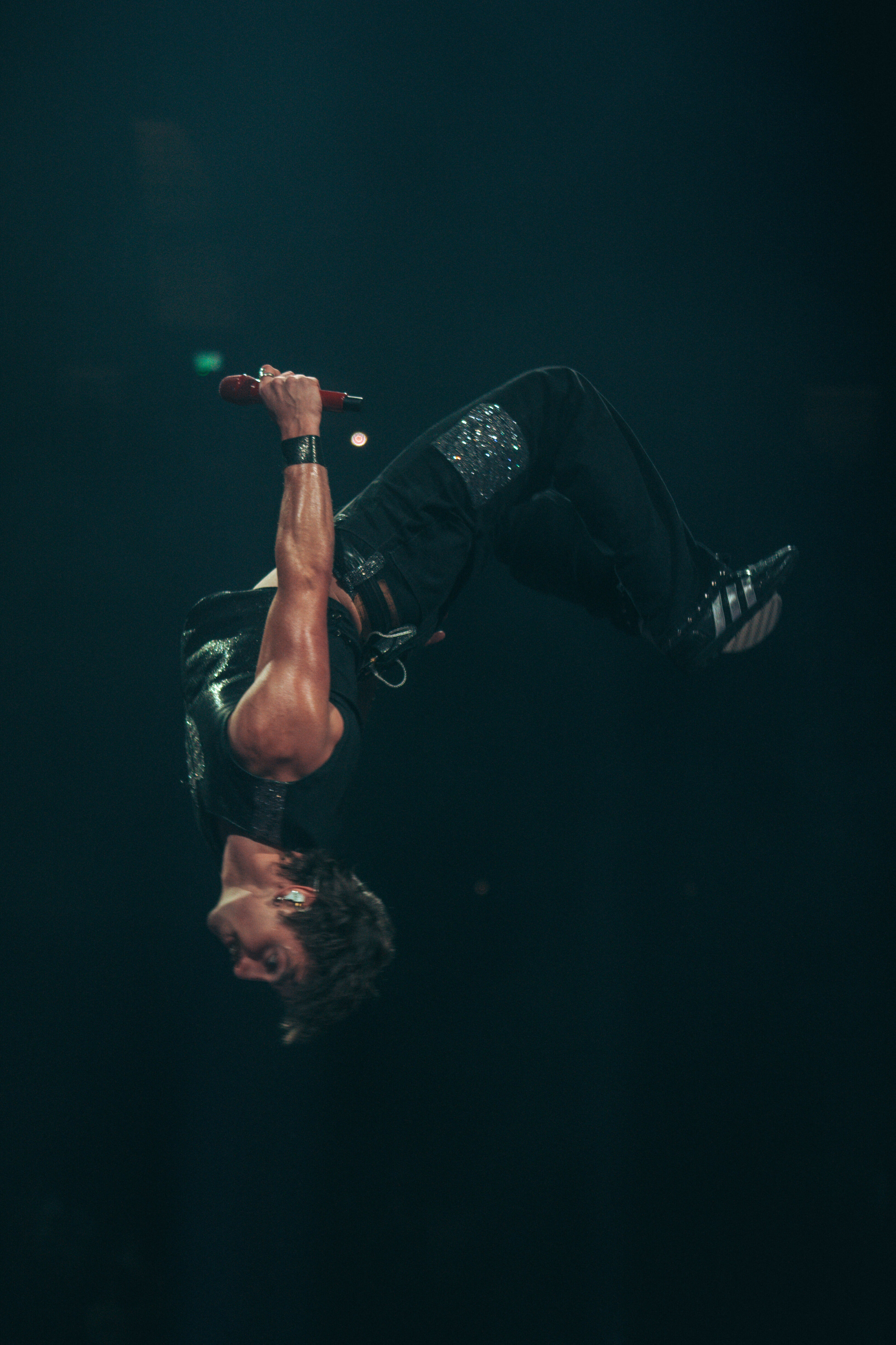 Benson Boone backflipping at the 02 for his American Heart Tour