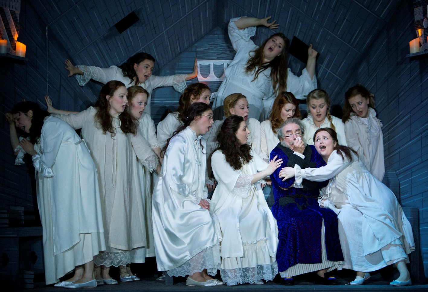 Major-General Stanley (Richard Suart) surrounded by his daughters in Scottish Opera's The Pirates of Penzance