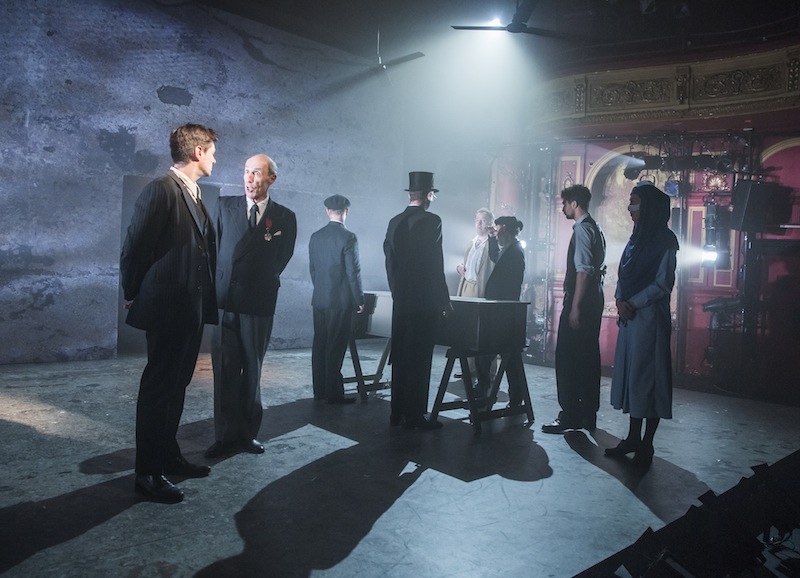 Shadow play: the cast gathers for Meursault's mother's funeral