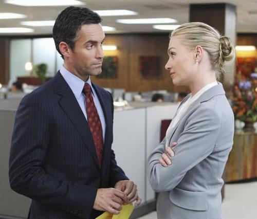 Ted (Jay Harrington) and Veronica (Portia De Rossi) locked in a power-meeting at Veridian Dynamics 
